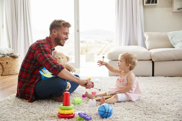 Father Young Daughter Playing Toy Instruments Home — Stock Photo, Image