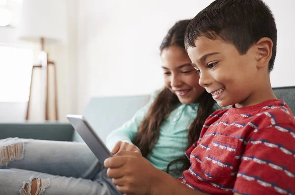 Brother Sister Sitting Sofa Playing Digital Tablet Together — Stock Photo, Image