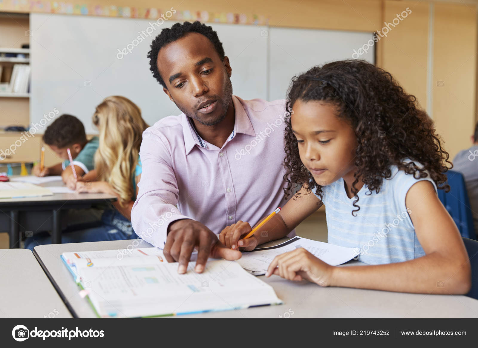 Teacher Working Elementary School Girl Desk Stock Photo