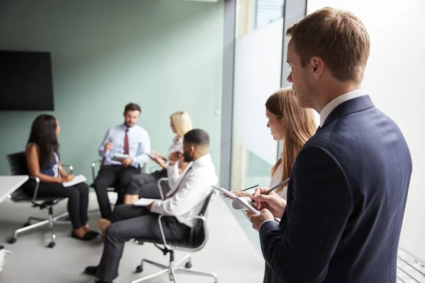 Group Having Discussion Graduate Recruitment Assessment Day Whilst Being Observed — Stock Photo, Image