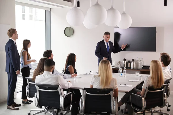 Mature Businessman Addressing Group Meeting Table Graduate Recruitment Assessment Day — Stock Photo, Image