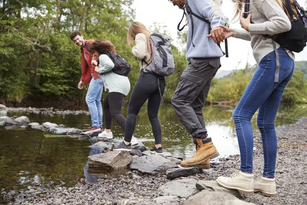 Multiethnic Group Five Young Adult Friends Holding Hands Walking Rocks — Stock Photo, Image