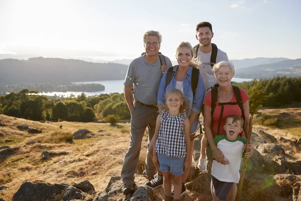 Portrait Multi Generation Family Standing Top Hill Hike Countryside Lake — Stock Photo, Image