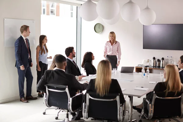 Mature Businesswoman Addressing Group Meeting Table Graduate Recruitment Assessment Day — Stock Photo, Image