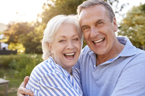 Portrait Loving Senior Couple Hugging Outdoors Summer Park Flaring Sun — Stock Photo, Image