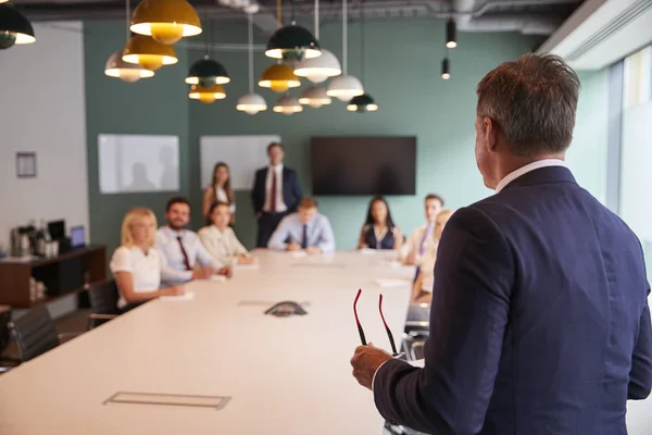 Mature Businessman Addressing Group Meeting Table Graduate Recruitment Assessment Day — Stock Photo, Image