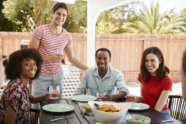 Adult Friends Sitting Table Outdoors Looking Camera — Stock Photo, Image