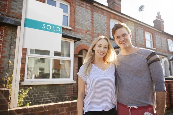 Portrait Excited Couple Standing New Home Sold Sign — Stock Photo, Image