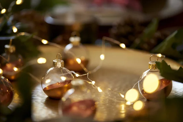Close Christmas Baubles Gold Table Warm Glow Selective Focus — Stock Photo, Image