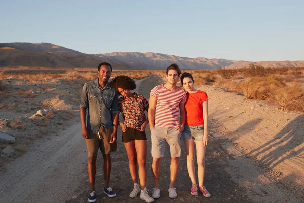 Two Young Adult Couples Desert Road Smiling Camera — Stock Photo, Image