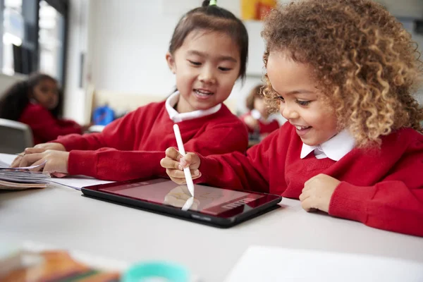 Close Two Kindergarten Schoolgirls Wearing School Uniforms Sitting Desk Classroom — Stock Photo, Image