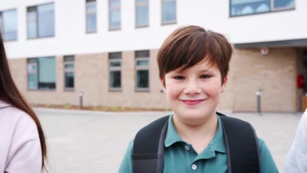 Camera Tracks Faces Smiling High School Pupils Standing School Building — Stock Video