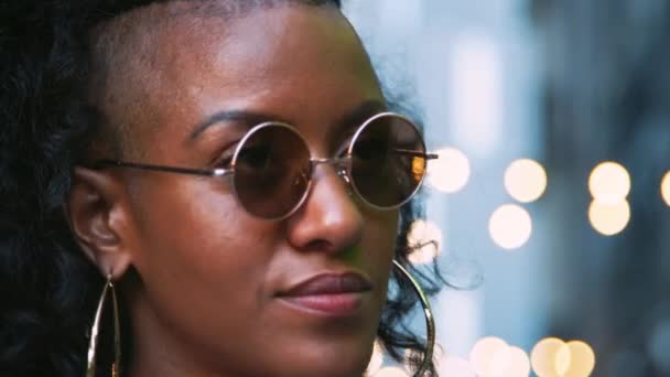 Fashionable Young Black Woman Wearing Sunglasses Looking Head Shot Bokeh — Stock Video