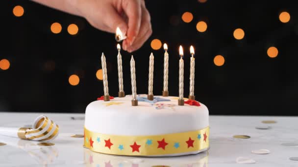 Close Hand Using Match Light Seven Candles White Decorated Birthday — Stock Video