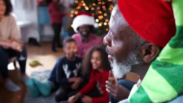 Multi Generation Family Wearing Party Hats Celebrating Christmas Home Together — Stock Video