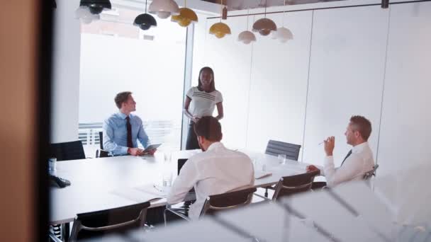 Businesswoman Standing Boardroom Table Giving Presentation Colleagues Shot Slow Motion — Stock Video