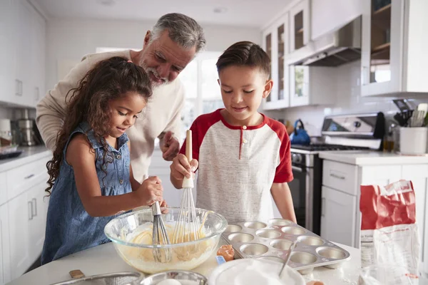 Brother Sister Standing Kitchen Table Mixing Cake Mix Grandfather Close — Stock Photo, Image