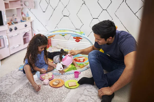 Young Girl Playing Tea Party Dad Sitting Floor Baby Brother — 스톡 사진