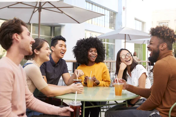 Six Trendy Millennial Friends Sitting Drinking Cold Brews Talking Laughing — Stock Photo, Image