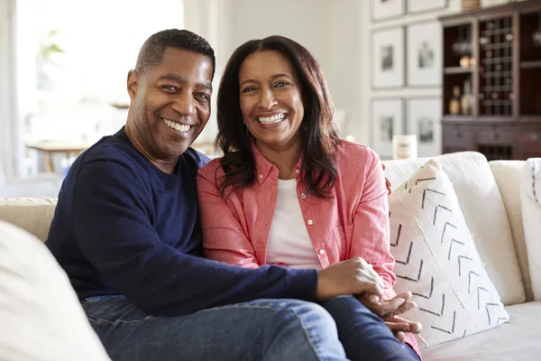 Middle Aged Mixed Race Couple Sitting Sofa Living Room Looking — Stock Photo, Image