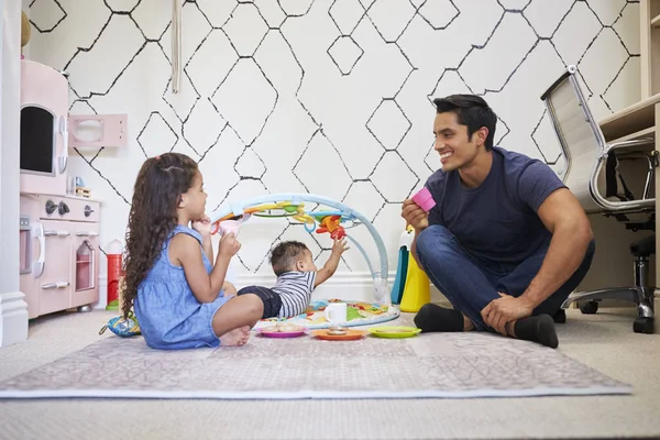 Young Girl Playing Tea Party Dad Sitting Floor Baby Brother — 스톡 사진