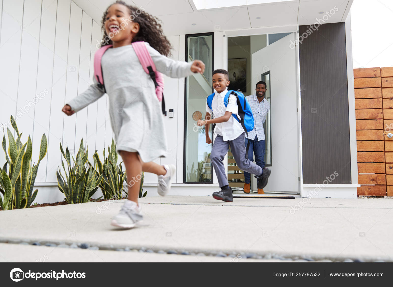 Excited Children Running Out Front Door Way School Watched Father