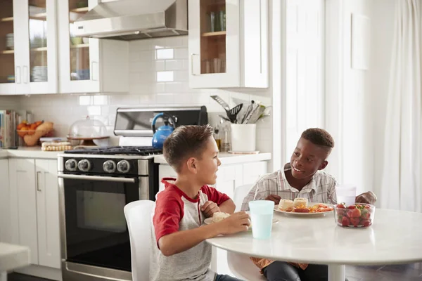 Two Pre Teen Male Friends Sitting Talking Kitchen Playdate — Stock Photo, Image