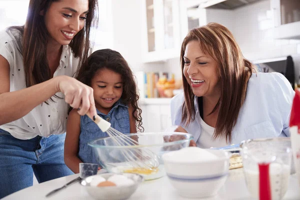 Young Girl Making Cake Kitchen Her Mum Grandmother — 스톡 사진