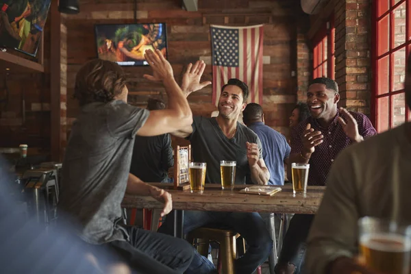 Group Male Friends Celebrating Whilst Watching Game Screen Sports Bar — Stock Photo, Image