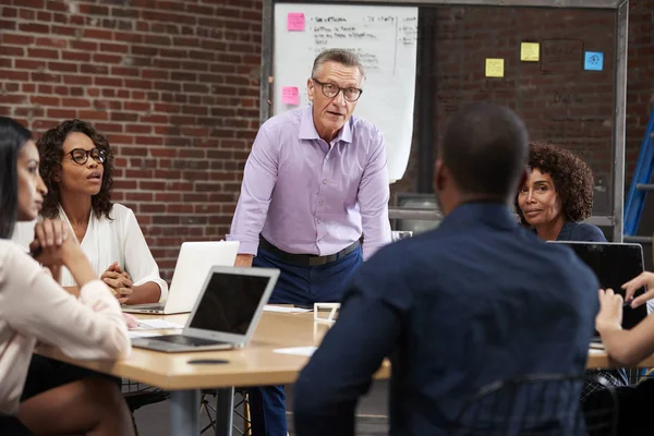 Mature Businessman Leading Office Meeting Colleagues Sitting Table — Stock Photo, Image