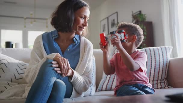 Young African American Mother Sitting Sofa Playing Her Three Year — Stock Video