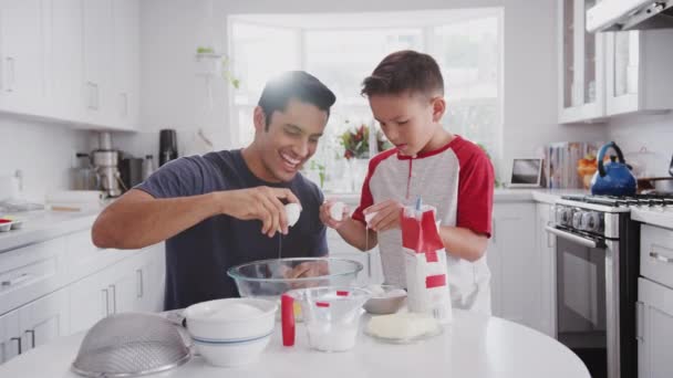 Jump Cut Clip Father Pre Teen Son Preparing Cake Mix — Stock Video