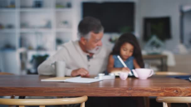 Senior Hispanic Man Sitting His Granddaughter Who Uses Stylus Tablet — Stock Video