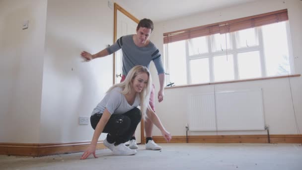 Couple Sitting Floor Empty Room New Home Planning Design — Stock Video