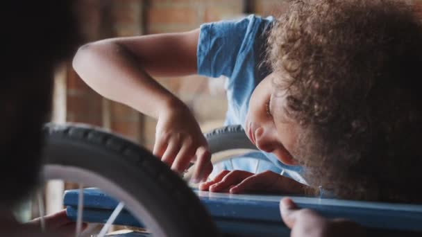 Pre Teen Boy Screwing Bolt Help His Dad While Making — Stock Video