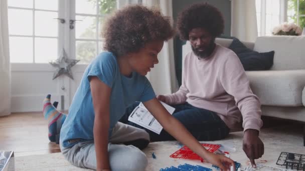 Middle Aged Black Father Sitting Floor Home Helping His Pre — Stock Video