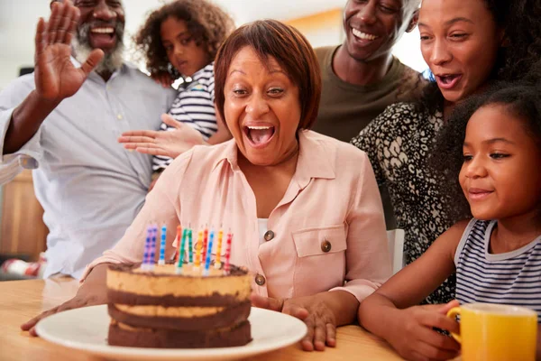 Multi Generation Family Celebrating Grandmother Birthday Home Cake Candles — Stock Photo, Image