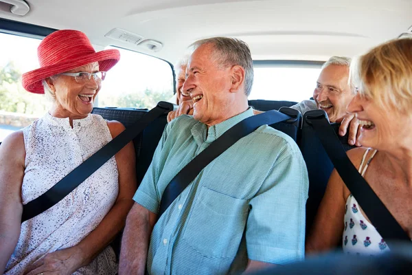 Group Senior Friends Sitting Back Van Being Driven Vacation — Stock Photo, Image