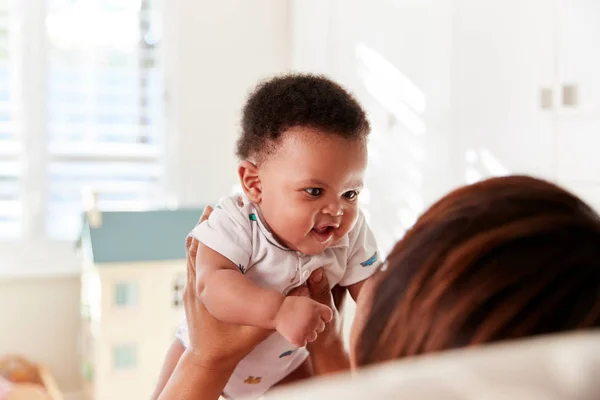 Proud Grandmother Cuddling Baby Grandson Nursery Home — Stock Photo, Image