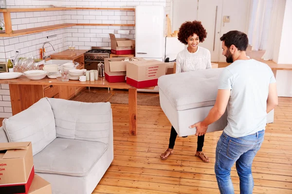 Smiling Couple Carrying Furniture New Home Moving Day — Stockfoto