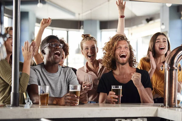 Group Male Female Friends Celebrating Whilst Watching Game Screen Sports — Stock Photo, Image