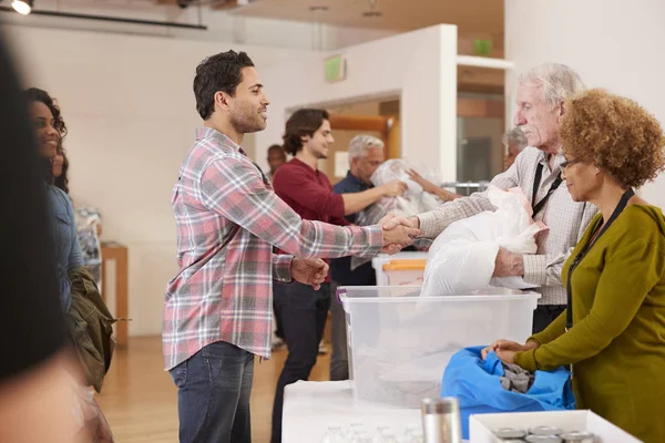 People Donating Clothing Charity Collection Community Center — Stock Photo, Image