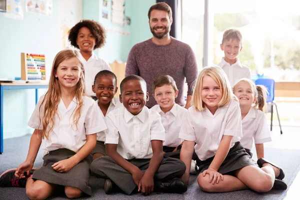 Portrait Elementary School Pupils Wearing Uniform Sitting Floor Classroom Male — Stock Photo, Image