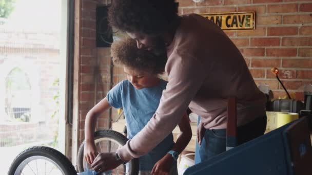 Middle Aged Father Helping His Pre Teen Son Use Spanner — Stock Video