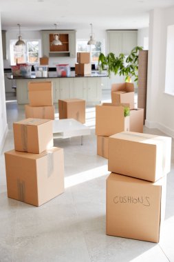 Stacked Removal Boxes In Empty Room On Moving Day clipart