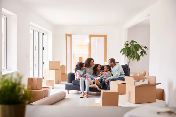 Family Taking Break Sitting Sofa Celebrating Moving New Home Together — Stock Photo, Image