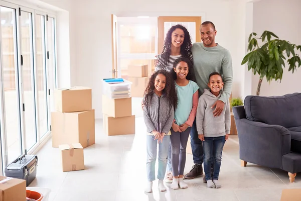 Portrait Family Surrounded Boxes Standing Room Moving Day — Stock Photo, Image
