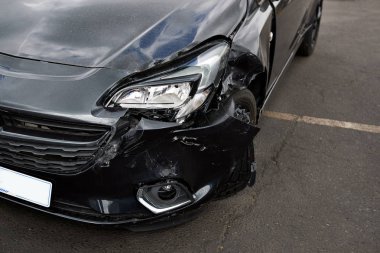 Detail Of Damage To Headlight Of Vehicle In Car Park clipart