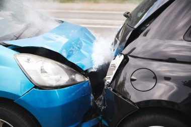 Close Up Of Two Cars Damaged In Road Traffic Accident clipart