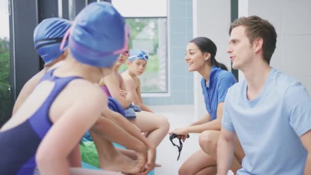 Group Children Sitting Swimming Pool Being Given Briefing Male Female — Stock Video